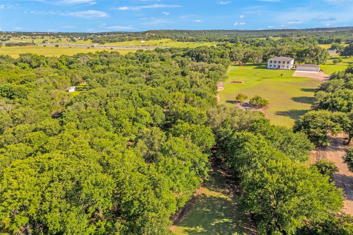 a view of a field with an ocean view