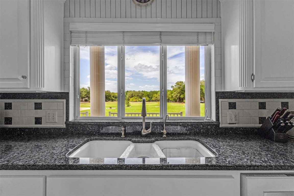 10299 Paddy Hamilton Road Belton, TX 76513 - Photo 17 of 39 a kitchen sink with a granite countertop window and sink