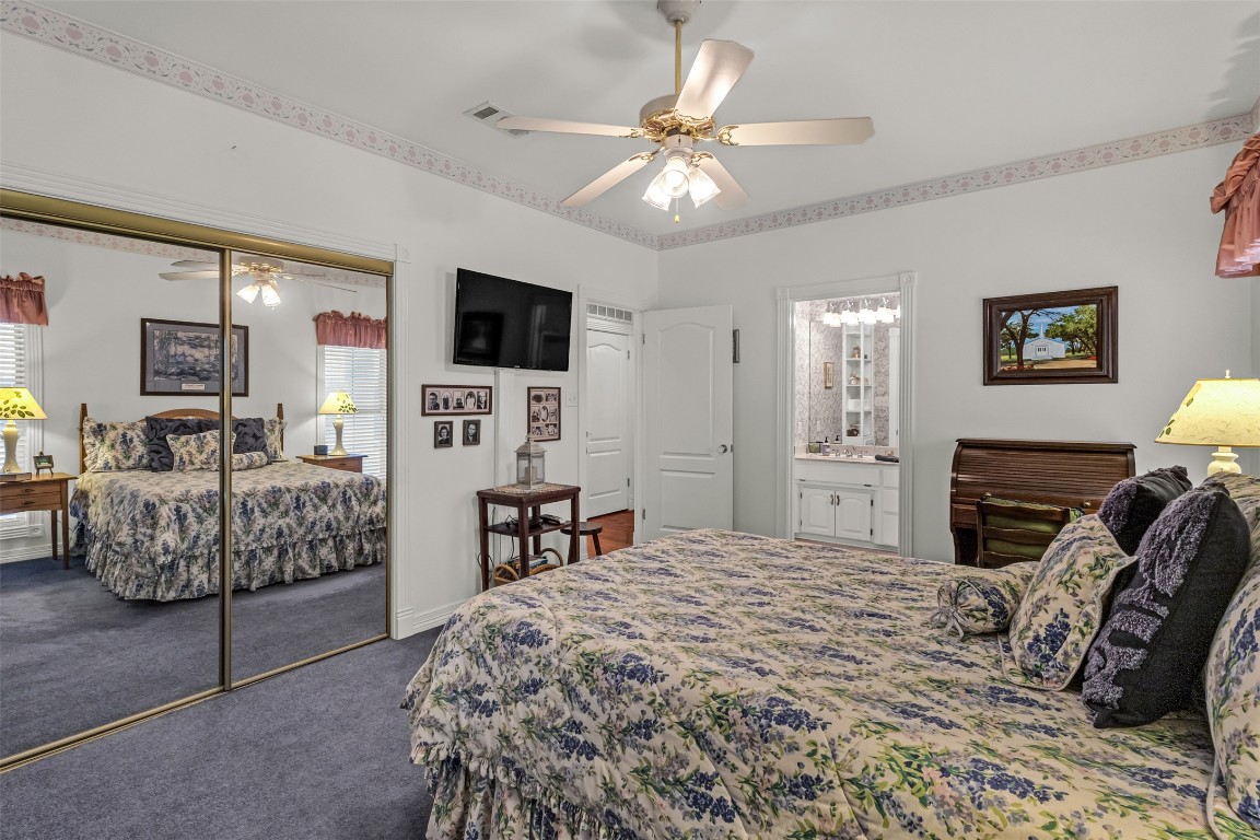 10299 Paddy Hamilton Road Belton, TX 76513 - Photo 36 of 39 a bedroom with a bed a couch and dresser