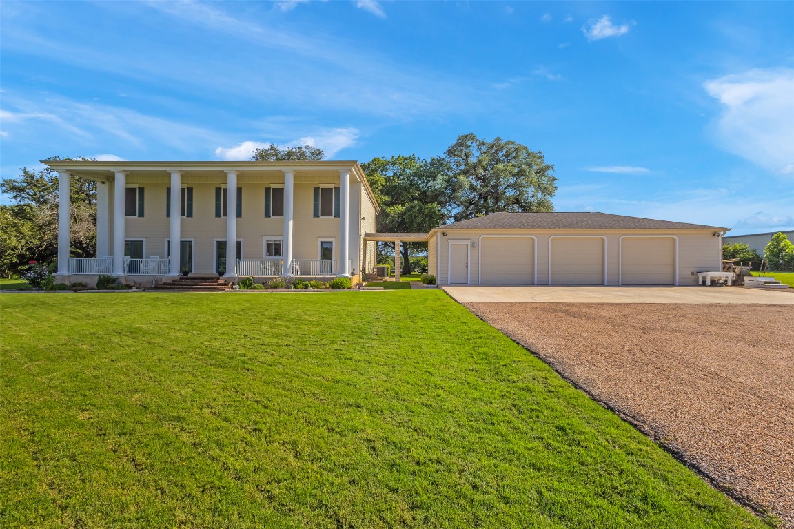 10299 Paddy Hamilton Road Belton, TX 76513 - Photo 8 of 39 a front view of a house with a yard and garage