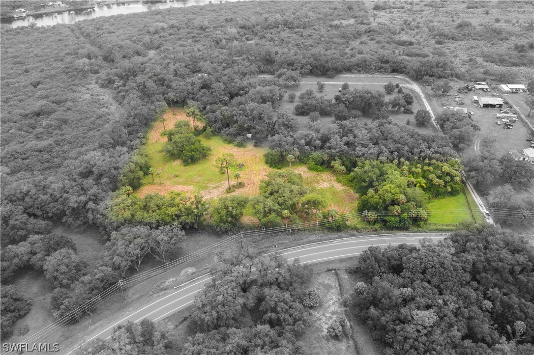 2379 County Road 78 LaBelle, FL 33935 - Photo 19 of 35 a view of a yard with a tree