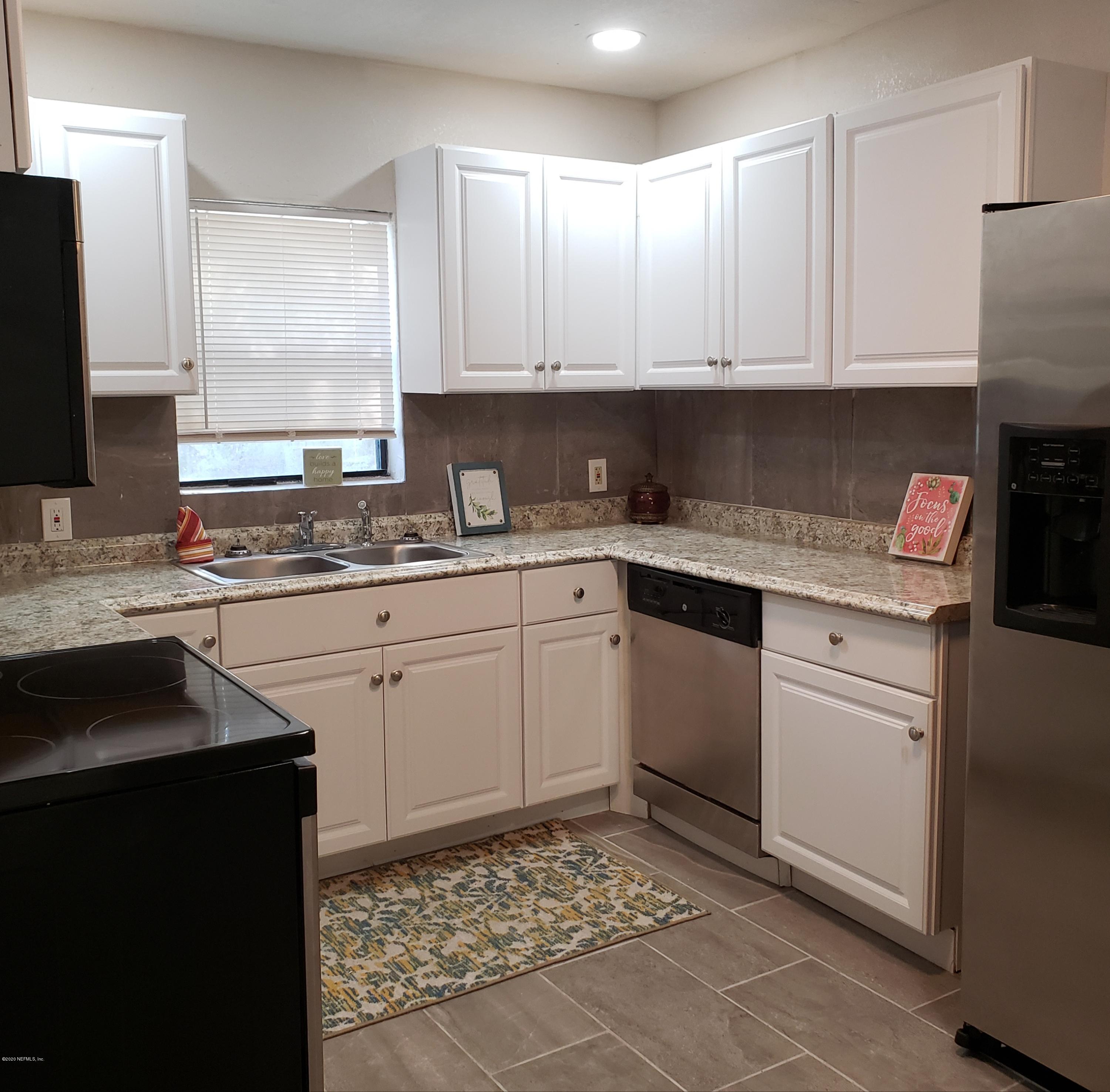 Kitchen view with appliances