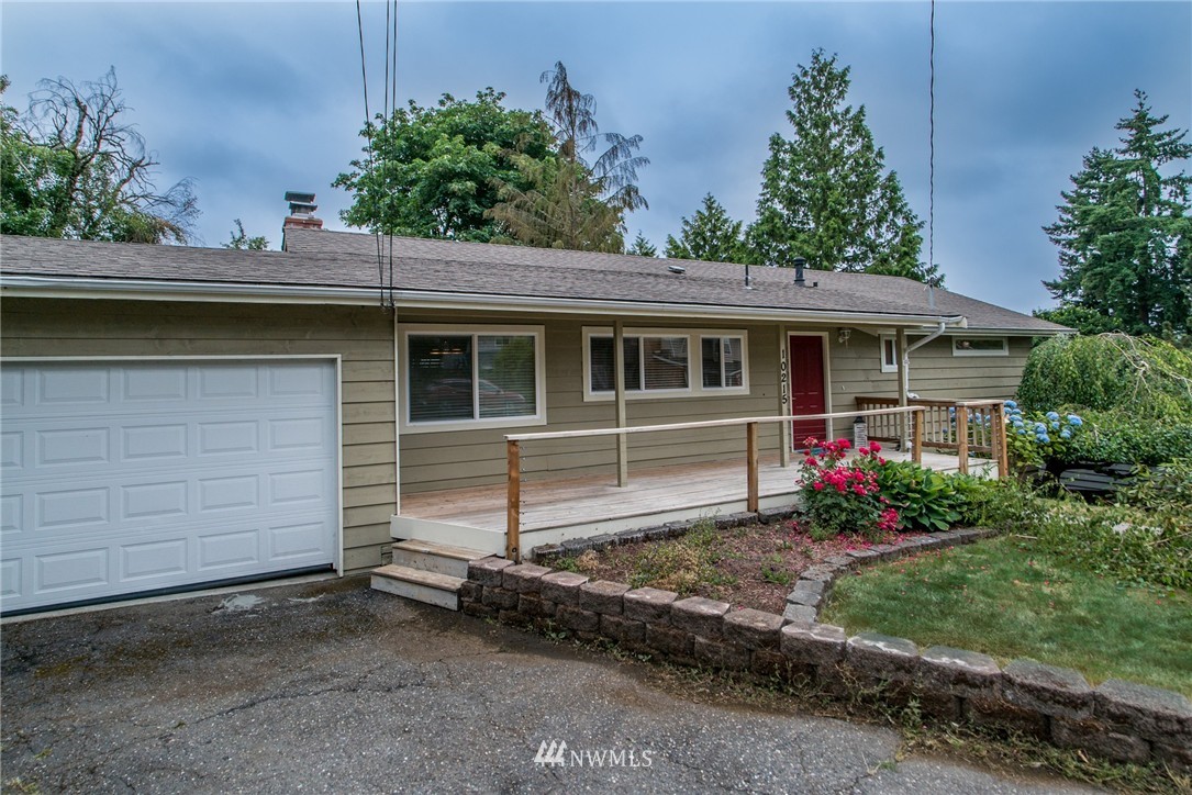 10215 Northeast 198th Street Bothell, WA 98011 - Photo 2 of 25 a house view with a garden space
