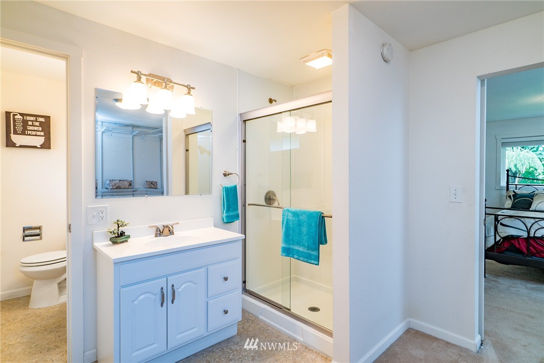 10215 Northeast 198th Street Bothell, WA 98011 - Photo 14 of 25 a bathroom with a tub sink and mirror