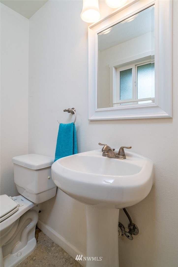 10215 Northeast 198th Street Bothell, WA 98011 - Photo 15 of 25 a bathroom with a sink toilet and mirror