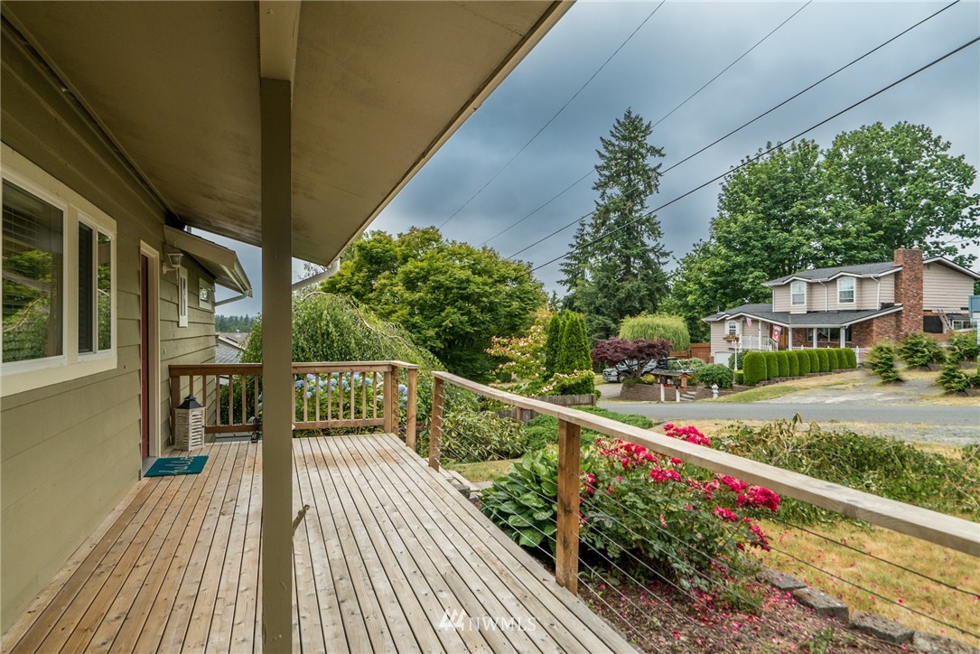 10215 Northeast 198th Street Bothell, WA 98011 - Photo 3 of 25 a view of a house with wooden deck