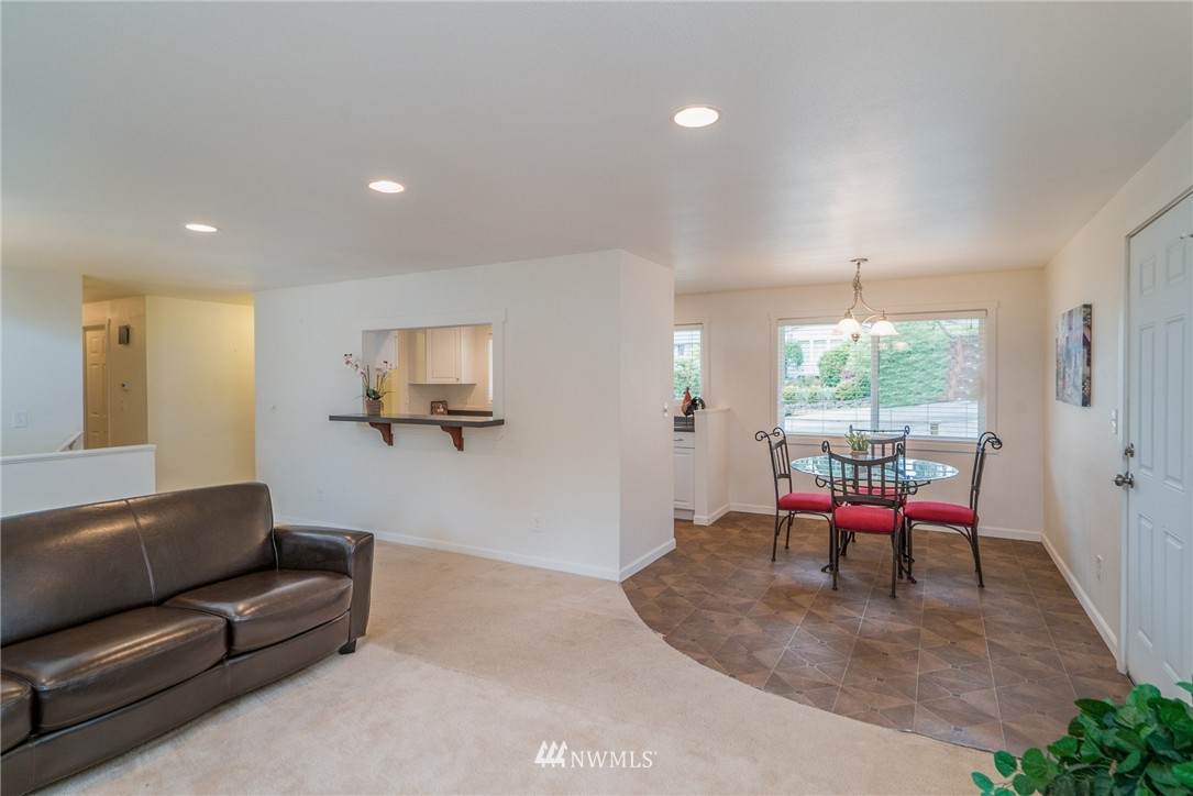 10215 Northeast 198th Street Bothell, WA 98011 - Photo 7 of 25 a living room with furniture and a window