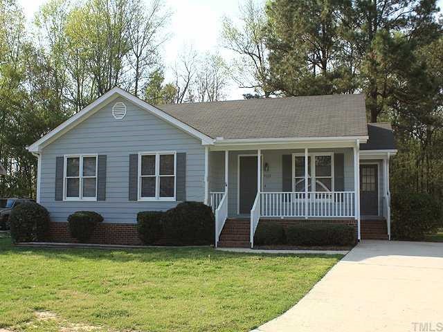 4125 Timberbrook Drive Raleigh, NC 27616 - Photo 1 of 12 a house that has a tree in front of it