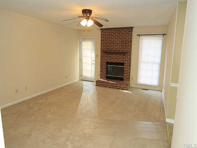 4125 Timberbrook Drive Raleigh, NC 27616 - Photo 3 of 12 a view of empty room with a fireplace