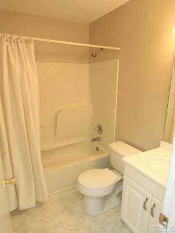4125 Timberbrook Drive Raleigh, NC 27616 - Photo 8 of 12 a bathroom with a toilet sink and shower