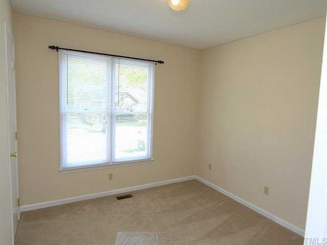 4125 Timberbrook Drive Raleigh, NC 27616 - Photo 9 of 12 an empty room with a window