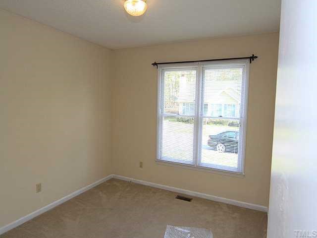 4125 Timberbrook Drive Raleigh, NC 27616 - Photo 10 of 12 an empty room with a window