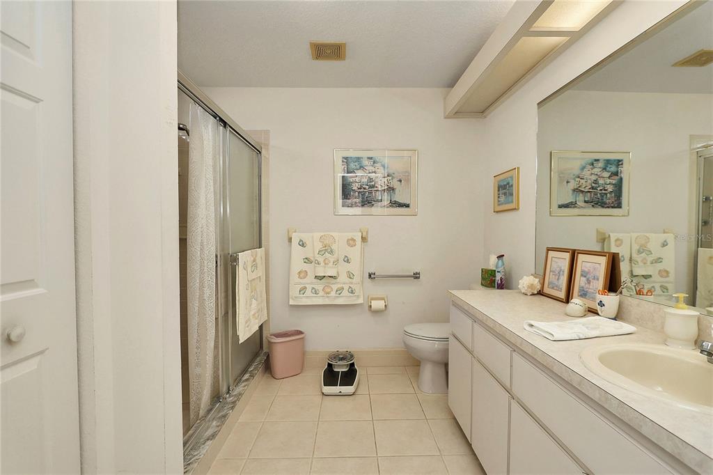 8319 Southwest 108th Loop Ocala, FL 34481 - Photo 16 of 27 a bathroom with a sink toilet and a mirror