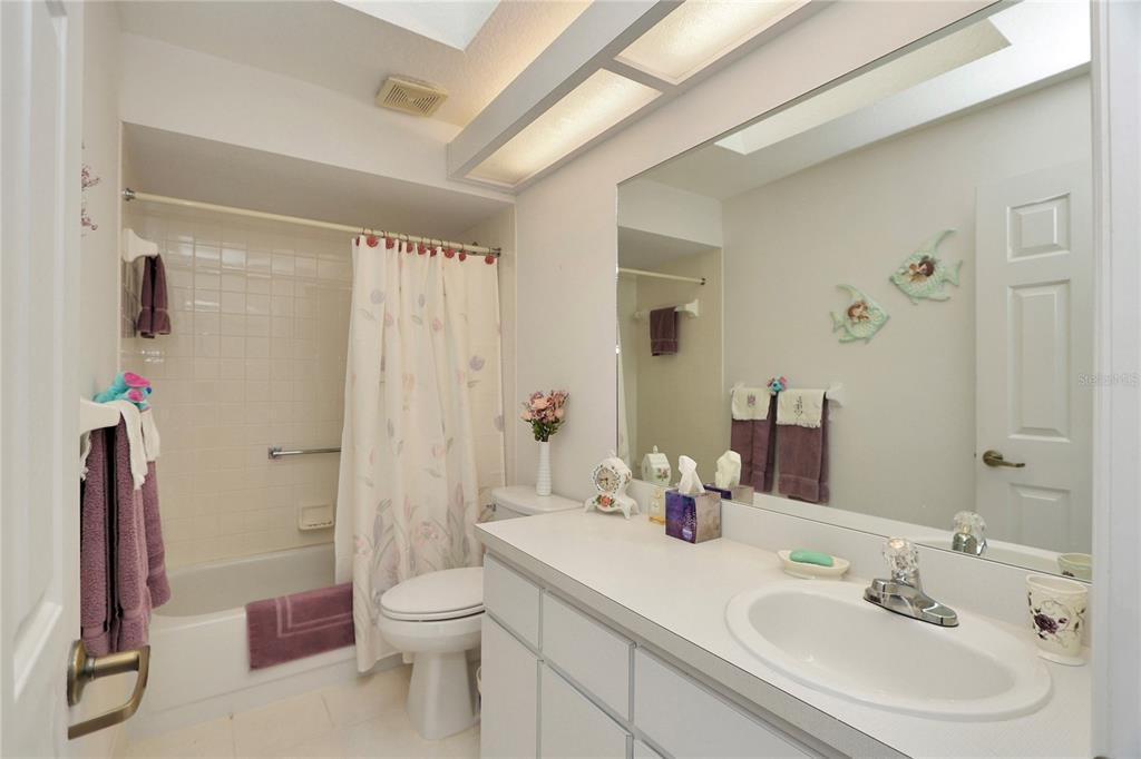 8319 Southwest 108th Loop Ocala, FL 34481 - Photo 20 of 27 a bathroom with a sink a toilet and shower