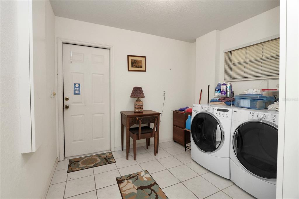 8319 Southwest 108th Loop Ocala, FL 34481 - Photo 23 of 27 a view of livingroom with washer and dryer