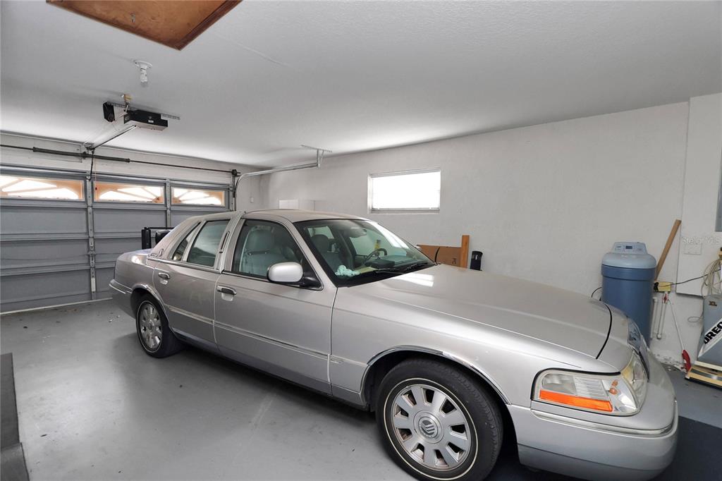 8319 Southwest 108th Loop Ocala, FL 34481 - Photo 24 of 27 a view of a car in garage