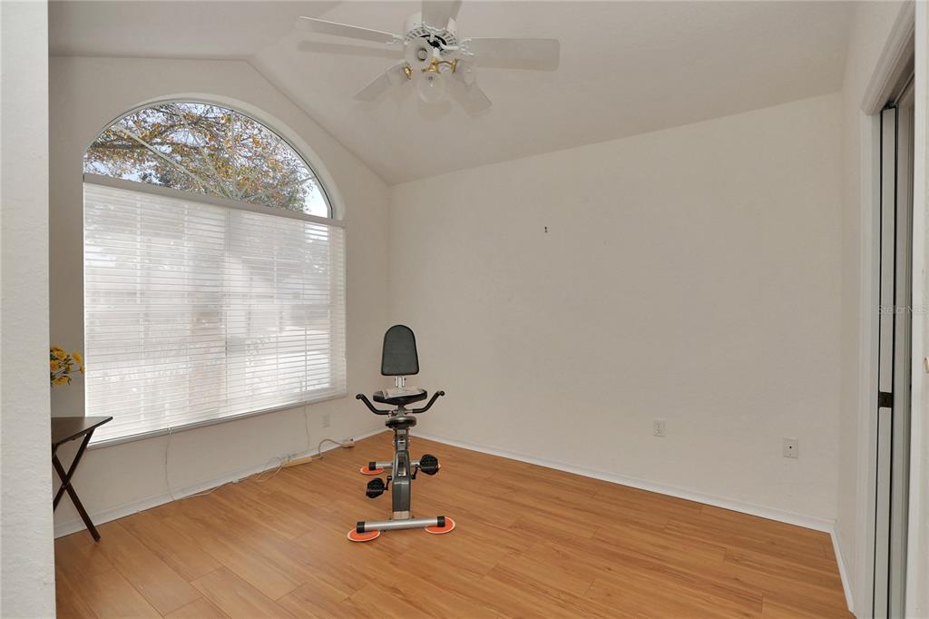 8319 Southwest 108th Loop Ocala, FL 34481 - Photo 8 of 27 a view of room with a chandelier and wooden floor