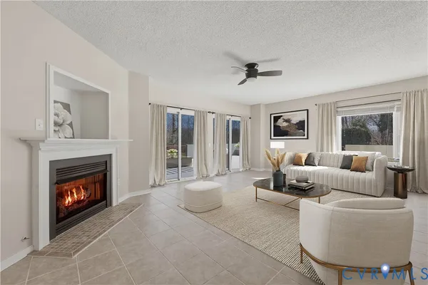 a living room with furniture and a fireplace