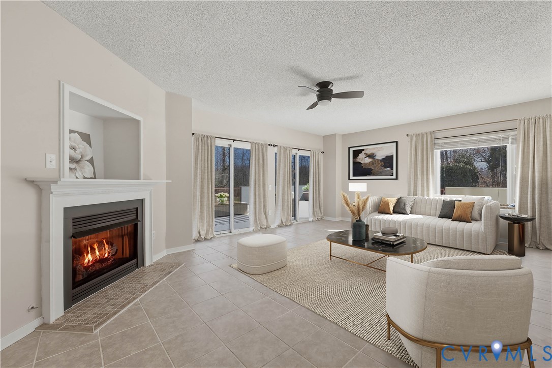 a living room with furniture and a fireplace