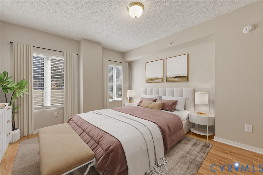 301 Beacon Ridge Drive, Unit 109 Hopewell, VA 23860 - Photo 15 of 30 a bedroom with a bed and a large window