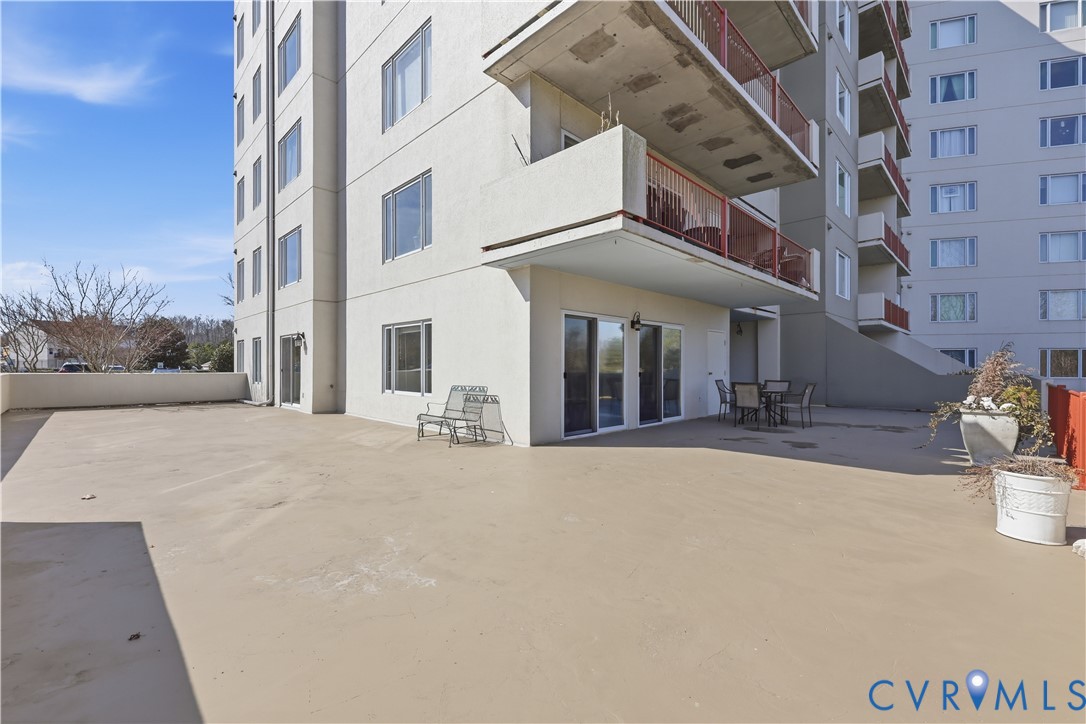 301 Beacon Ridge Drive, Unit 109 Hopewell, VA 23860 - Photo 20 of 30 a view of a building with a yard