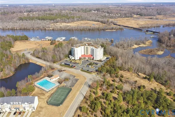 an aerial view of a house with a lake view