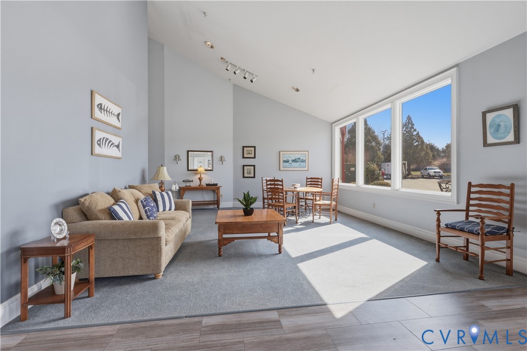 301 Beacon Ridge Drive, Unit 109 Hopewell, VA 23860 - Photo 23 of 30 a living room with furniture and a large window
