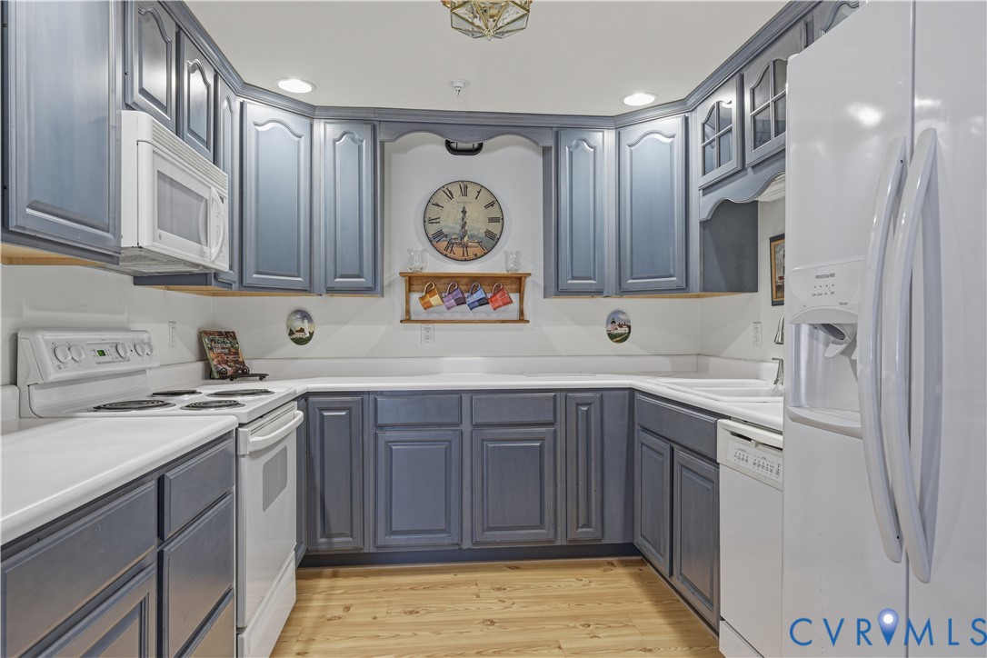 301 Beacon Ridge Drive, Unit 109 Hopewell, VA 23860 - Photo 26 of 30 a kitchen with stainless steel appliances granite countertop a sink and cabinets