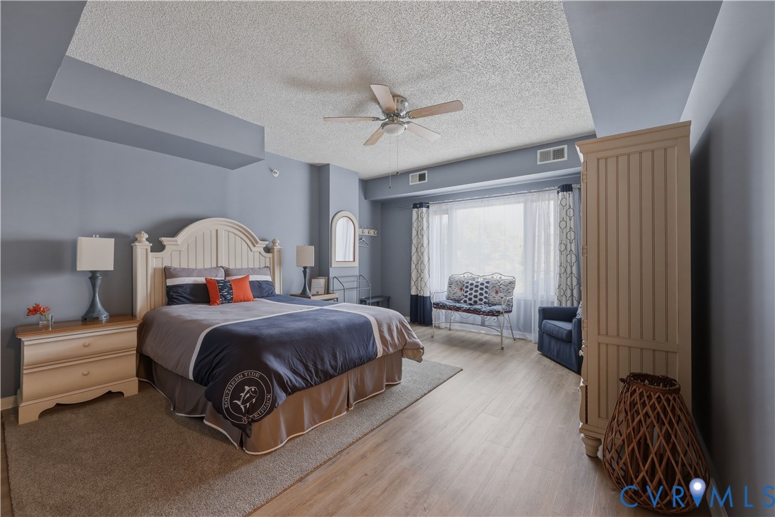 301 Beacon Ridge Drive, Unit 109 Hopewell, VA 23860 - Photo 27 of 30 a living room with a bed furniture and a window