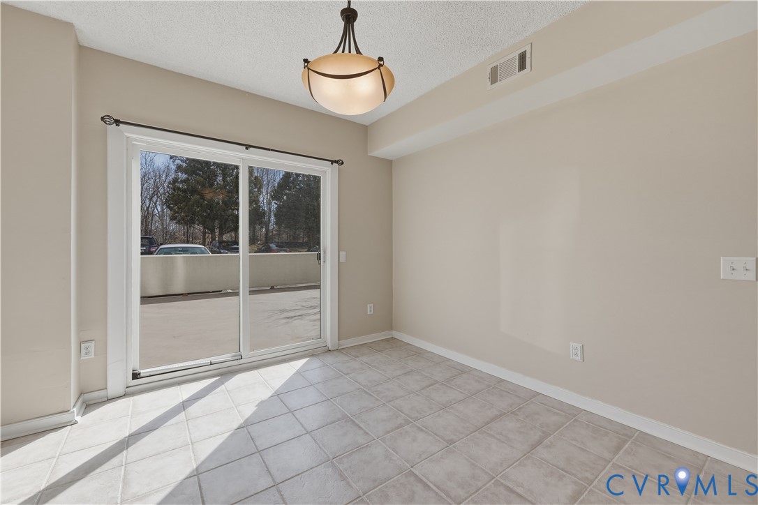301 Beacon Ridge Drive, Unit 109 Hopewell, VA 23860 - Photo 6 of 30 a view of empty room with sliding door