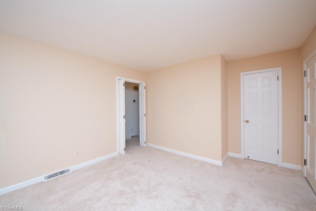 510 Gatewood Avenue High Point, NC 27262 - Photo 10 of 46 Door from living room into hallway..nice coat closet by front door