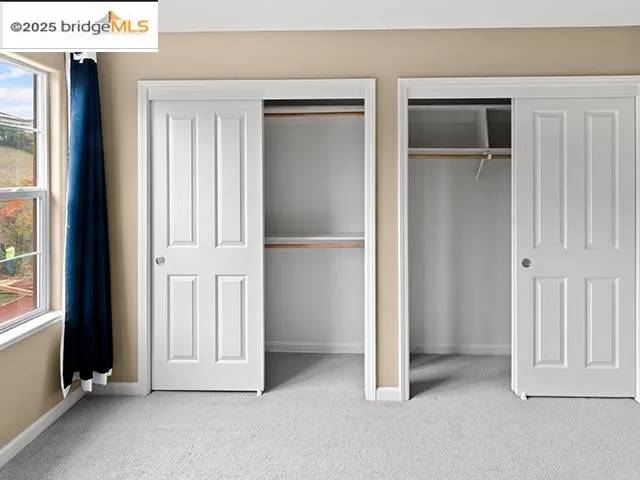 a spacious bathroom with a double vanity sink and a mirror