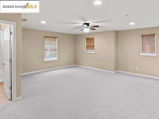 a bathroom with a granite countertop sink and a bathtub