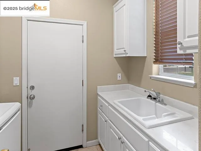 a kitchen with granite countertop a sink and a window