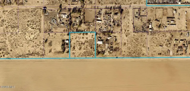 a view of a livingroom with wooden floor