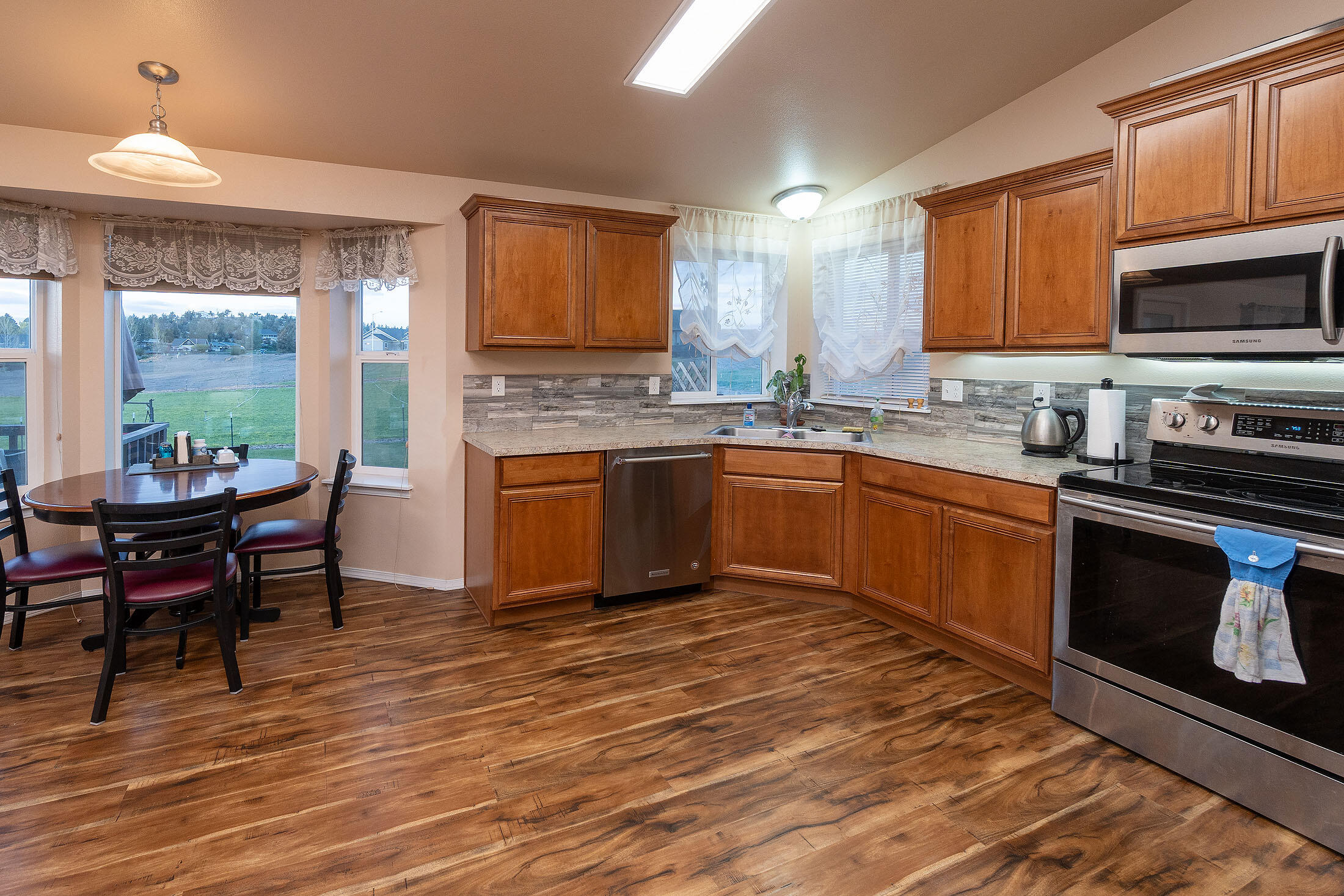 411 Northwest Mc Donald Road Prineville, OR 97754 - Photo 8 of 47 Large, open kitchen area. Pantry located next to breakfast bar, to the left of the photo.