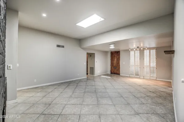 a kitchen with stainless steel appliances a refrigerator and a stove top oven