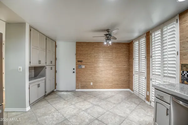 a view of a dining room with furniture and window
