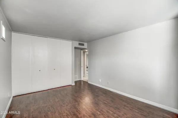 a view of an empty room with a window