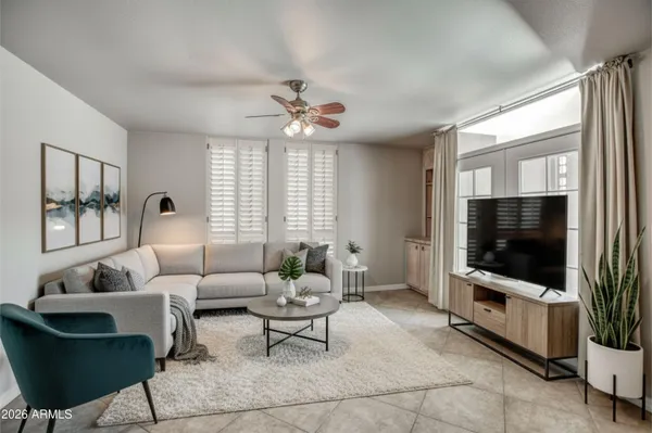 a view of a kitchen with a sink and a refrigerator