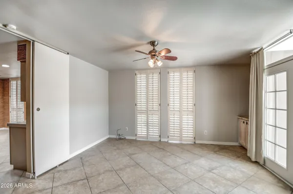 a kitchen with refrigerator and microwave