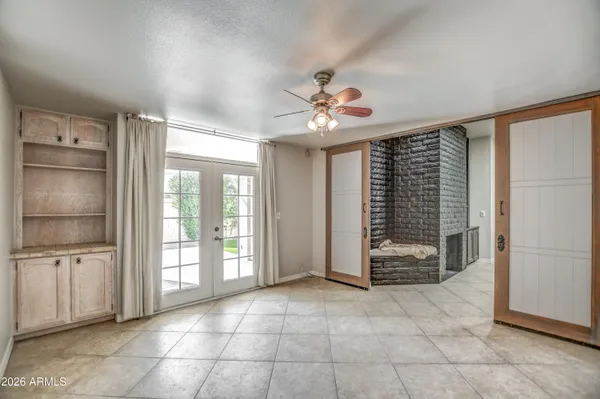 a kitchen with kitchen island granite countertop cabinets and stainless steel appliances