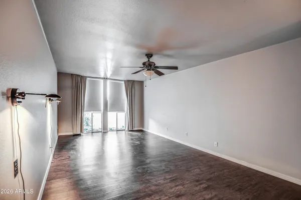 a view of a room with wooden floor