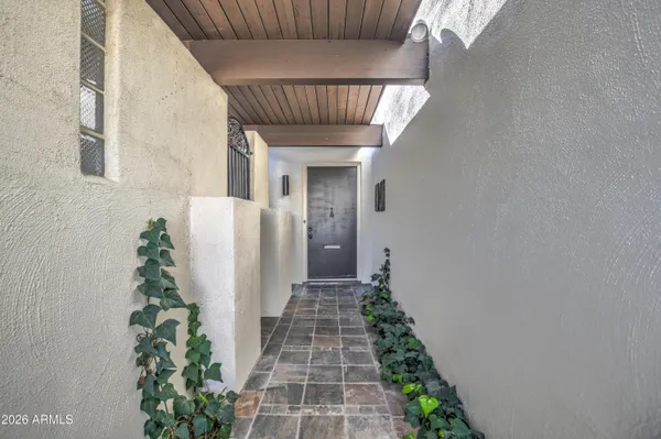 a view of an empty room and fire place