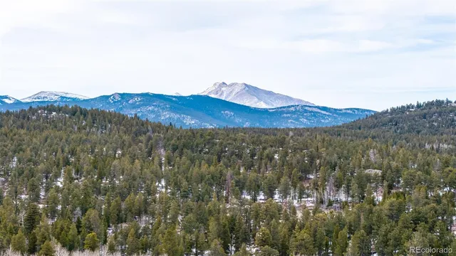 a view of a town with mountains in the background