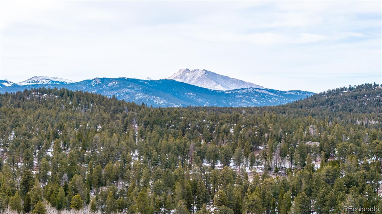 190 Hard Way Road Ward, CO 80481 - Photo 13 of 29 a view of a large mountain with a mountain in the background