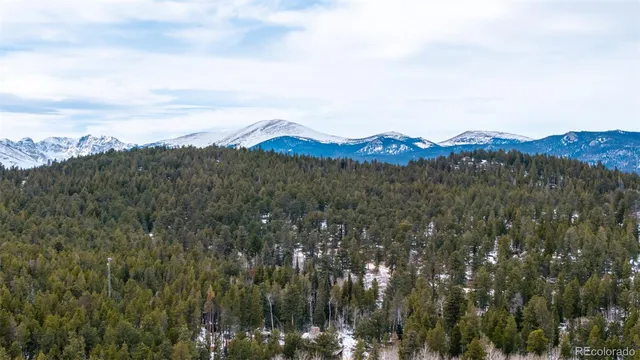 a view of mountains and valleys