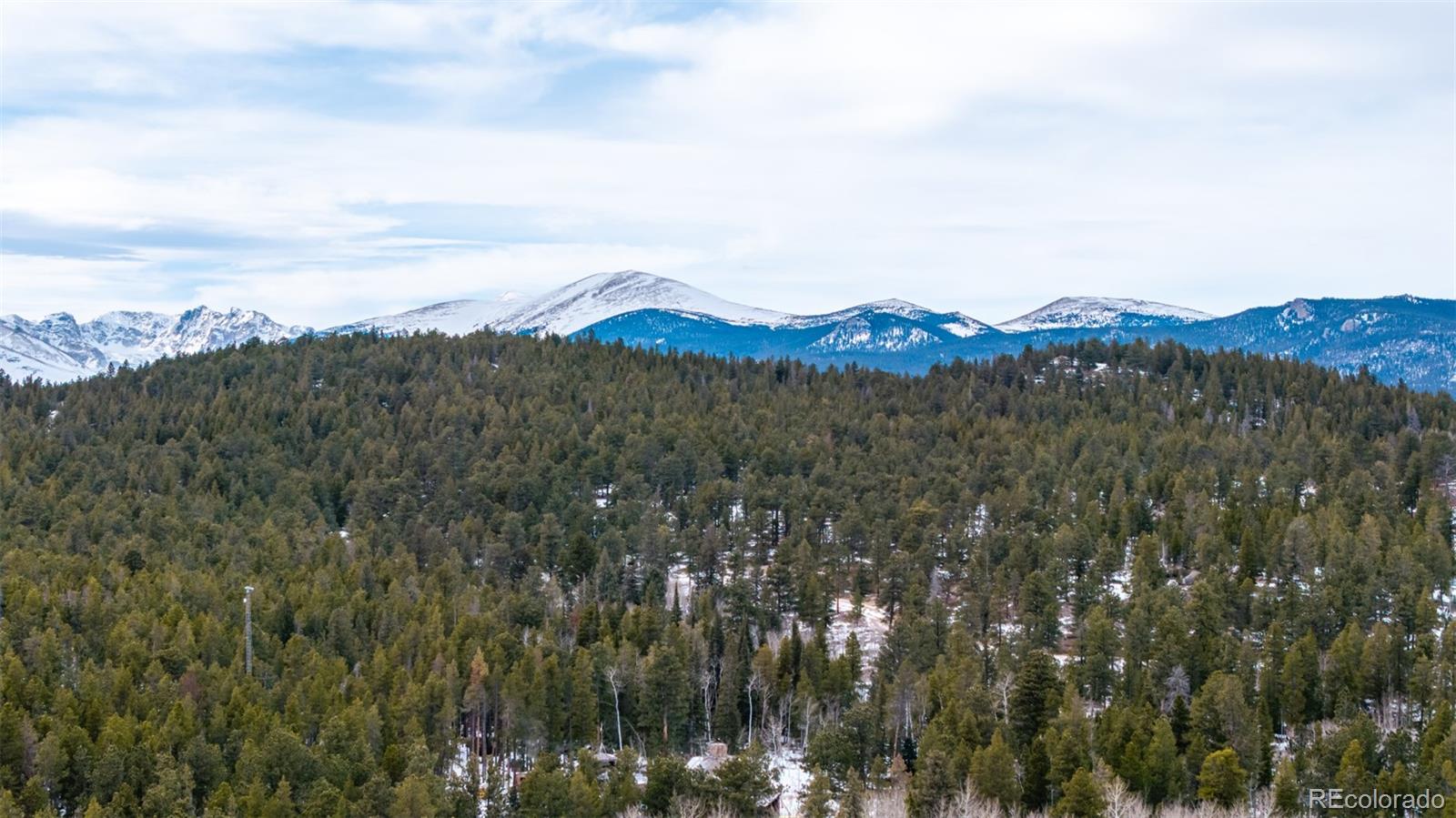 190 Hard Way Road Ward, CO 80481 - Photo 14 of 29 a view of a town with mountains in the background