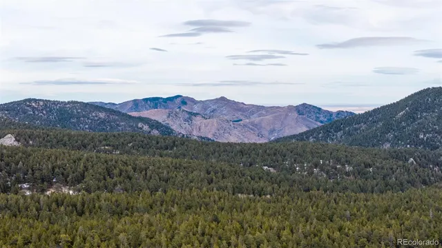 a view of mountain view with mountains in the background