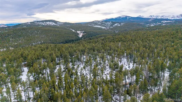 a view of a town with mountains in the background